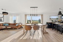 Wohnzimmer Hochwertiges Einfamilienhaus mit Feldblick - moderne Technik & familienfreundliche Lage in Ummern.