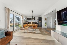 Wohnzimmer Hochwertiges Einfamilienhaus mit Feldblick - moderne Technik & familienfreundliche Lage in Ummern.